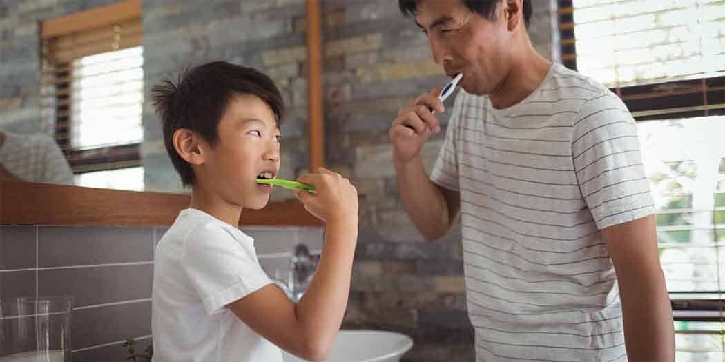 Father Son Brushing Teeth